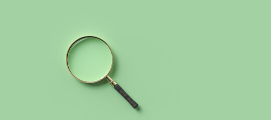 magnification glass on the left on empty green background