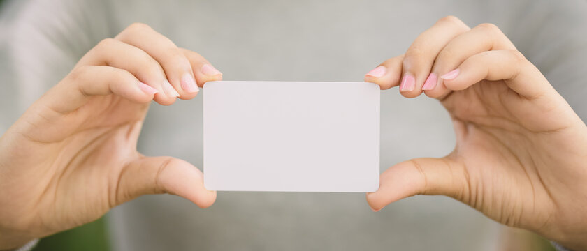 Young Female Holding Blank Credit Card, Outdoor