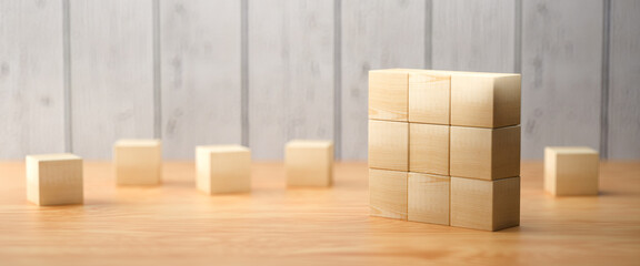 empty wooden cubes for own messages and icons on wooden background