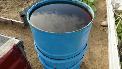 blue rainwater barrel for irrigation