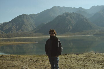 man on a mountain lake 