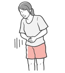お腹に手をあてる腹痛の若い女性