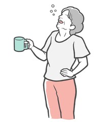 腰に手をあててうがいをする中年女性