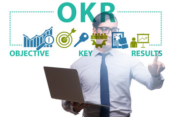 Fototapeta na wymiar OKR concept with objective key results and businessman