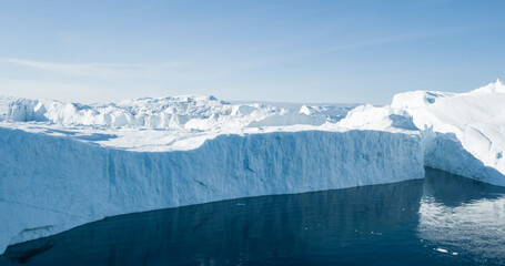 Global Warming and Climate Change concept. Icebergs from melting glacier in icefjord - Icefjord in...