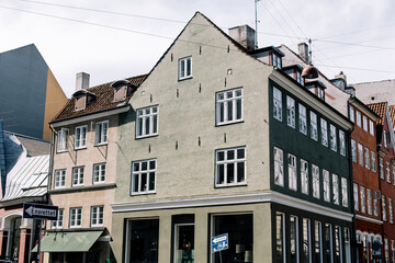 Fototapeta premium Colorful traditional buildings and apartments along a street in Copenhagen, Denmark