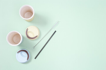 Obraz na płótnie Canvas Metal drinking straws, bamboo coffee cup. Zero waste concept.
