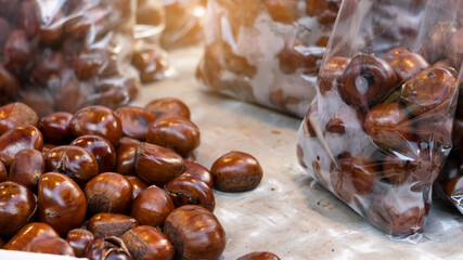 Chestnuts in trays and bags sold in the Thai market