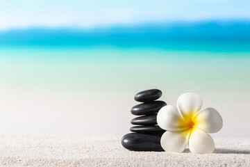 Stack of zen stones on sand beach