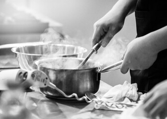 Chef cooking in a kitchen, chef at work, Black & White.
