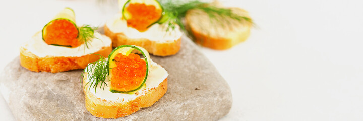 Sandwich with ricotta, a cucumber, caviar .