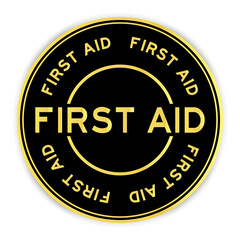 Black and gold color round sticker with word first aid on white background