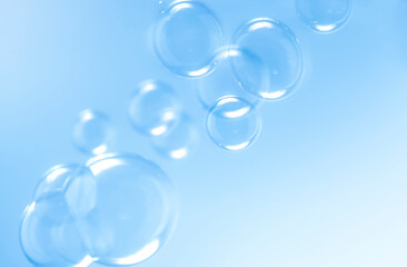 transparent clear blue soap bubbles float background.