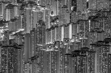 Aerial view of crowded residential building in Hong Kong city at night