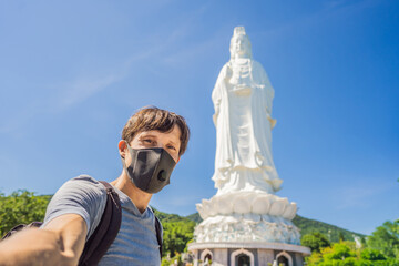 Male tourist in Da Nang, Vietnam wears a medical mask during a new wave of coronavirus in Vietnam...