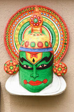 Indian Handicraft Kerala Traditional Kathakali Dancer. Display Of Colorful Handmade Souvenirs Beautiful Wooden Carving Of Face Wearing Ornaments Made Of Wood In Delhi, India. 