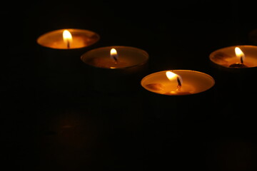 candles that are lit in the dark