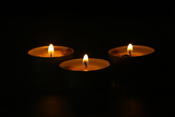 candles that are lit in the dark