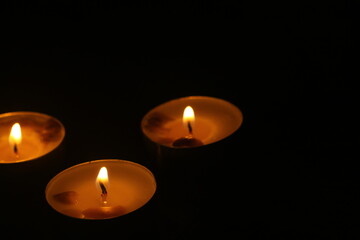 candles that are lit in the dark