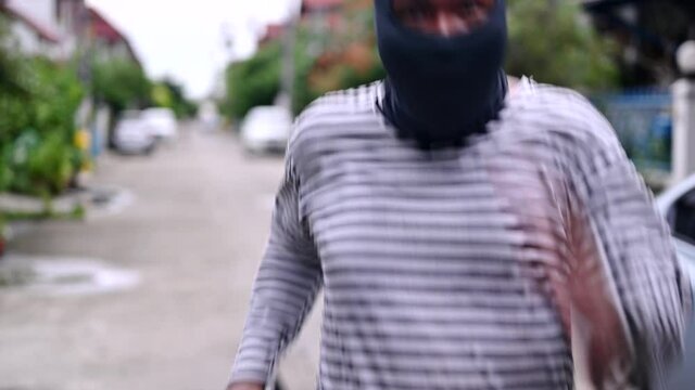 The robber carried the money bag and run away. 