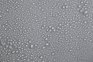 Large number of water drops. Abstract background texture. Waterfalls on a solid background, collecting bubbles on a clean surface. Raindrops, a series of natural photographs