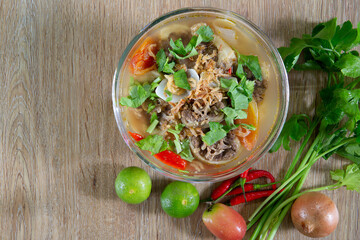 Oxtail soup, halal food, delicious, Muslim food in glas bowl on brown wooden floor
