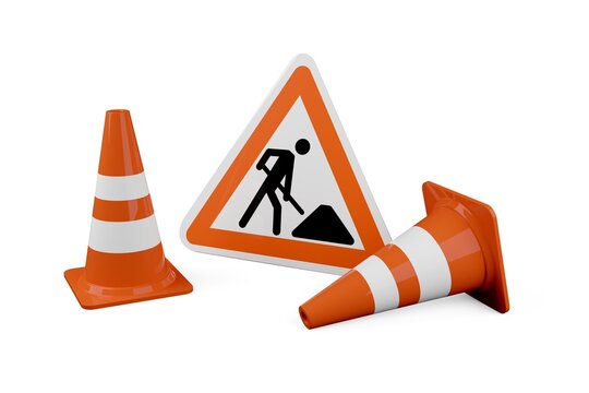 Two orange traffic warning cones or pylons with street or road construction sign on white background - under construction, maintenance or attention concept