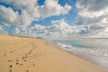 Sand dunes on the beach and beautiful cloudy sky