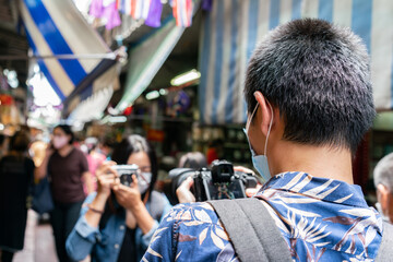 Photographer take a photo traveler at famous place