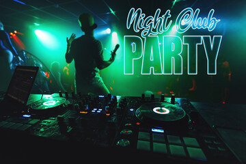 Fototapeta na wymiar inscription Night Club Party on the background of the music mixer DJ