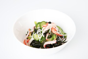 Vinegared dish with crab kanikama, cucumber and seaweed. Japanese food
