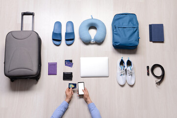 Set of travel accessories on wooden background