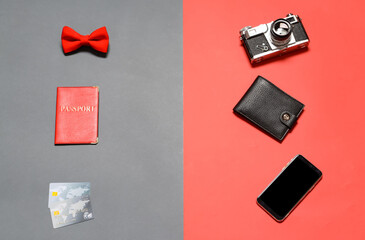 Set of travel accessories on color background