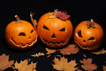 decor of pumpkins and maple leaves with acorns for Halloween