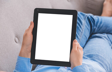 Woman with modern tablet computer at home