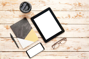 Composition with modern tablet computer on wooden background