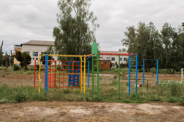 children's playground in park on a green meadow