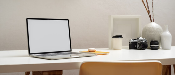 Cropped shot of laptop with clipping path on white table in home office