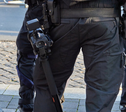 Belt Of A German Policeman In Black Uniform With A Camcorder To Preserve Evidence By Video Recording