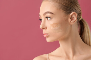 Beautiful young woman with foundation on her face against color background - obrazy, fototapety, plakaty