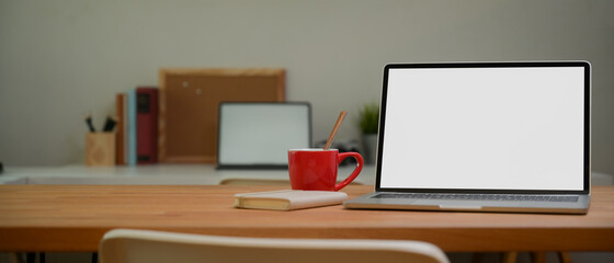 Portable workspace with laptop, mug, diary book and copy space, clipping path.v