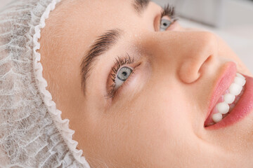 Woman undergoing cosmetic procedure in beauty salon, closeup