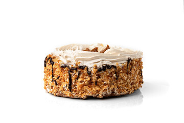 Cake with cream and nuts isolated on white background.
