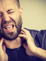 Man having throat, neck pain