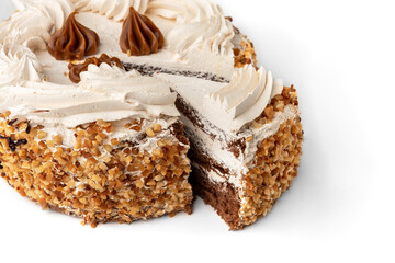 Cake with cream and nuts isolated on white background.