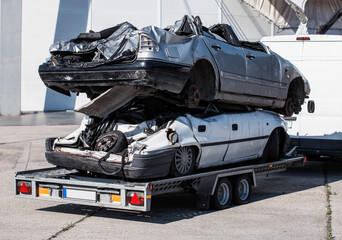 Two wrecked car on trailer