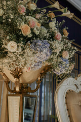 flower bouquet on wedding chair. golden concept wedding