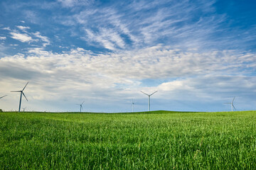 Fototapeta na wymiar Wind turbine in the field. Wind power energy concept
