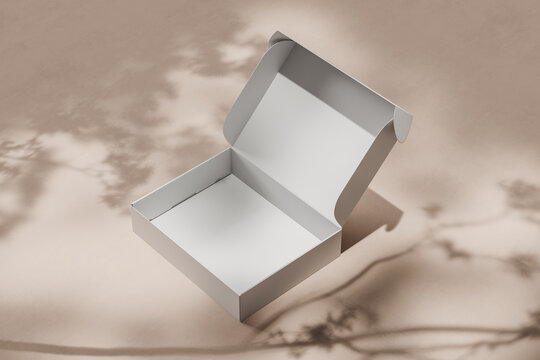 White Open Empty Cardboard Box For Packing A Gift Or Order On A Light Beige Background With Shadows. Side View. Mock Up. 3d Rendering