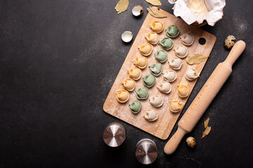 homemade colorful dumplings on a wooden board